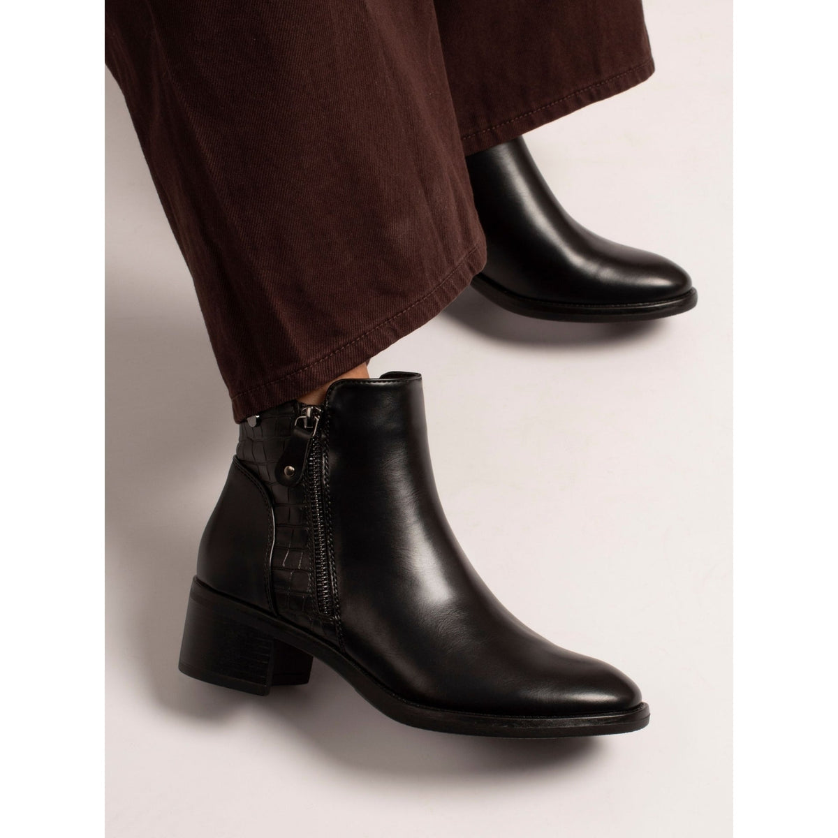 Lunar Hayley black ankle boots on model